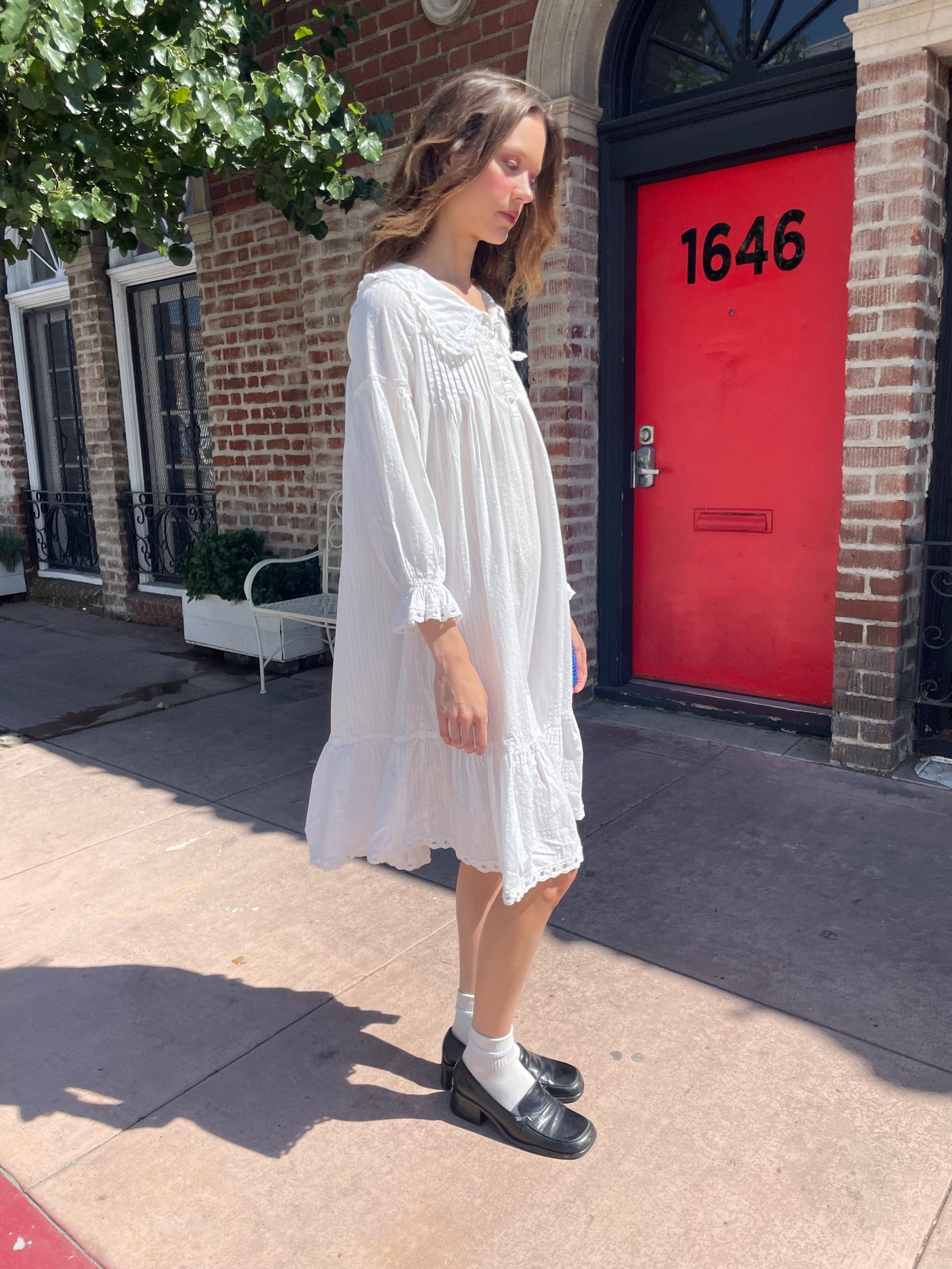 girl in long sleeve white dress