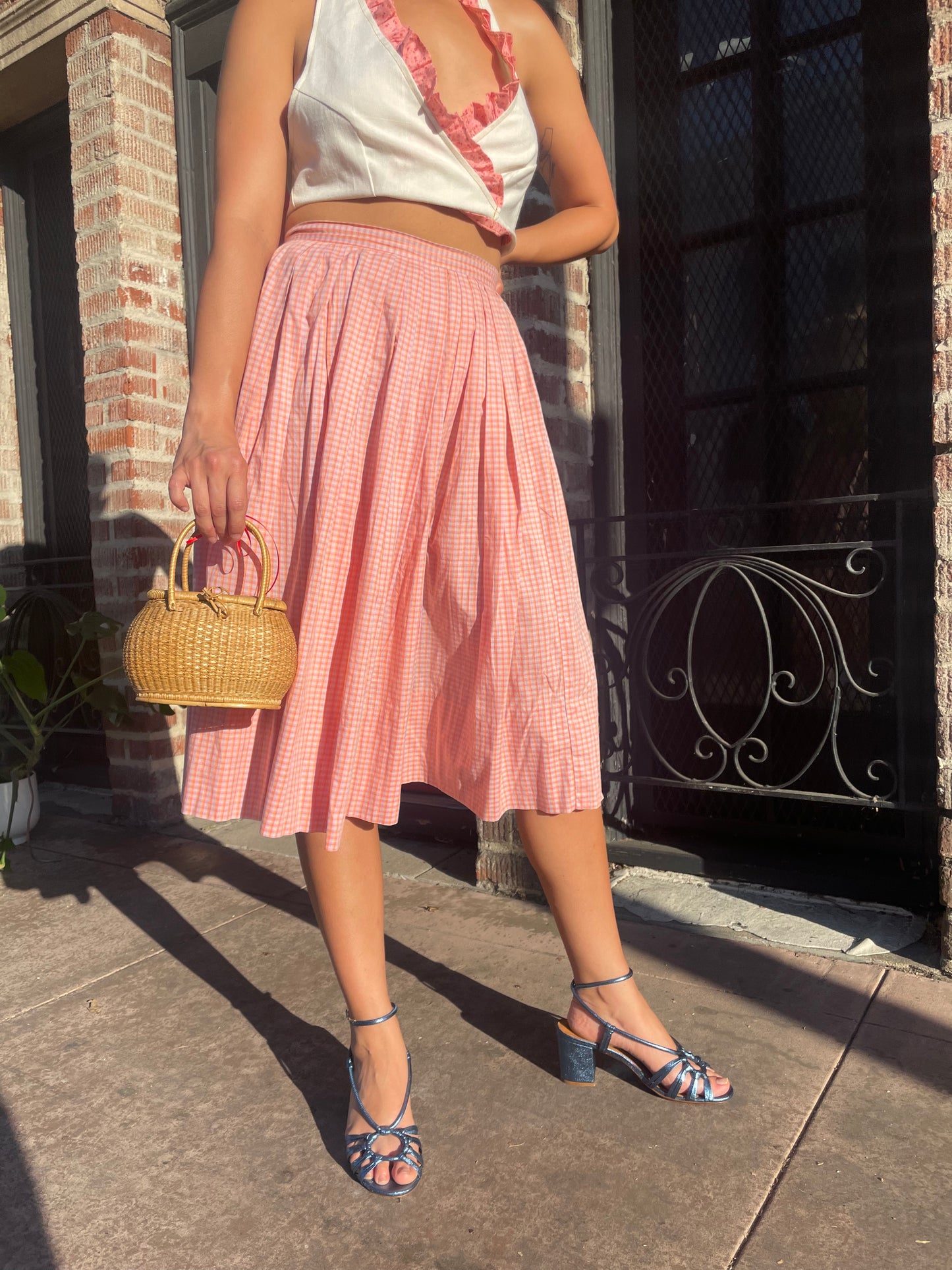 girl in cream halter and pink skirt