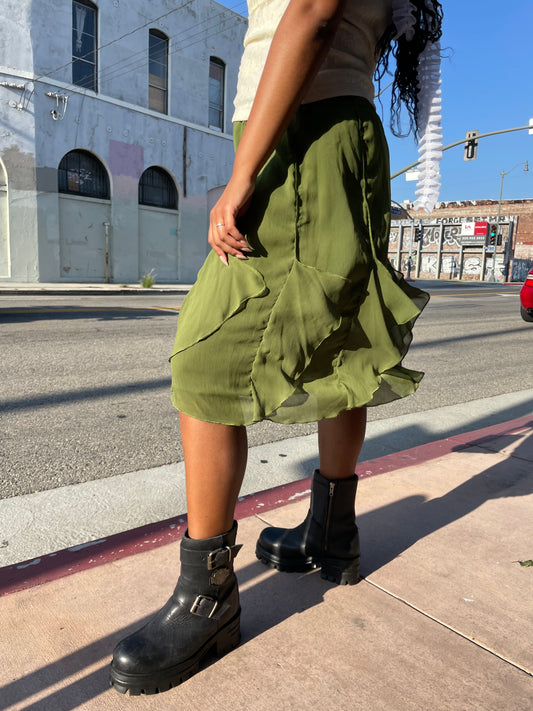 girl in green ruffle skirt