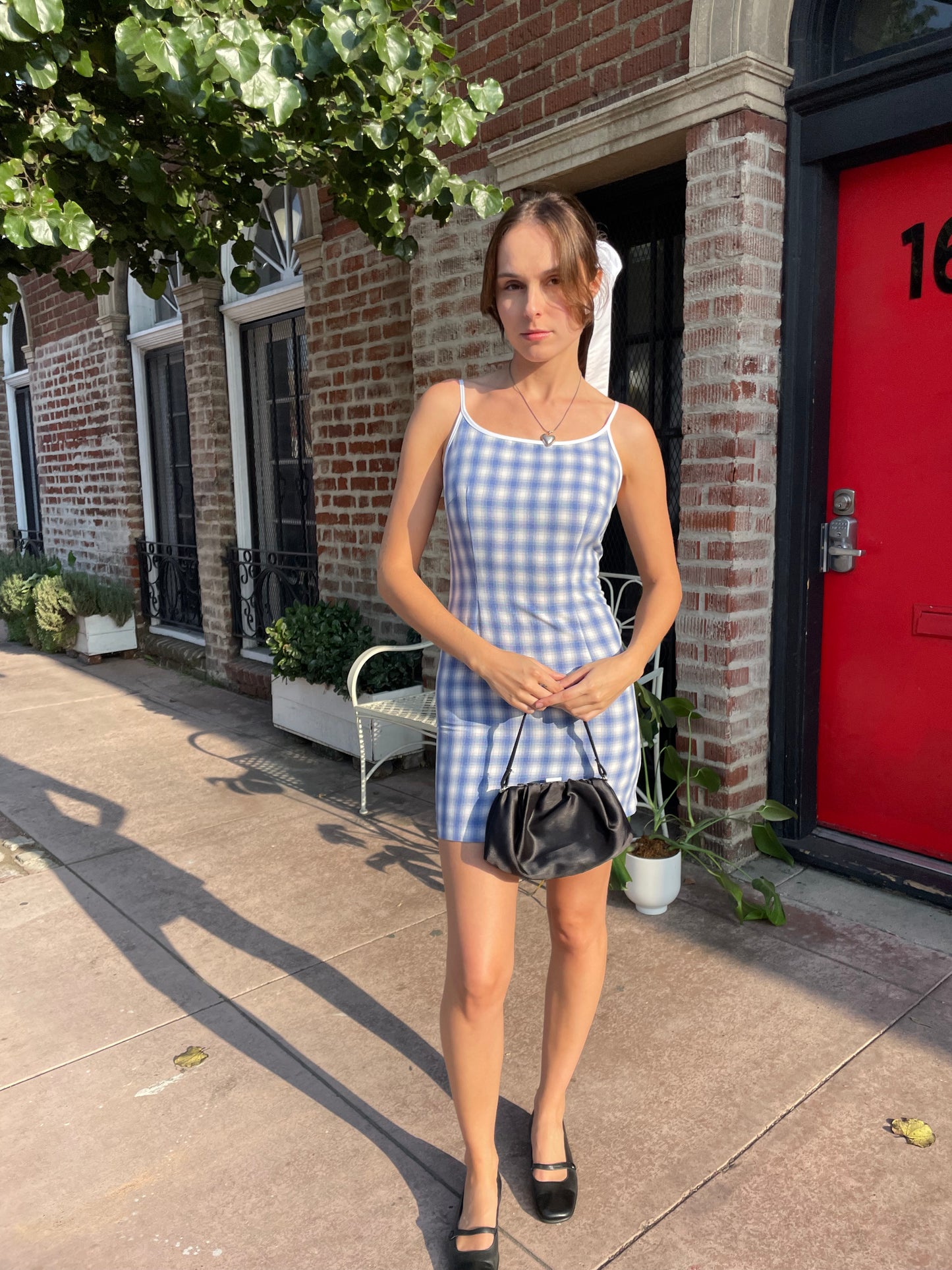 girl in blue gingham dress