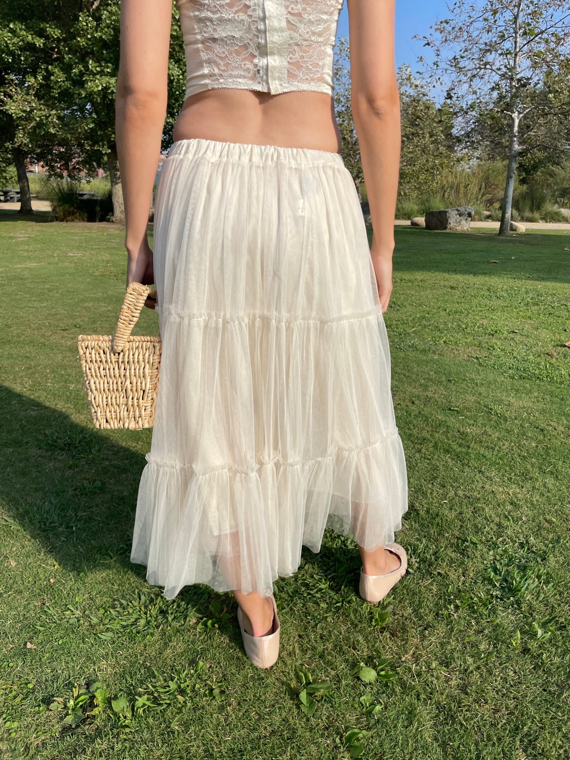 girl in white corset and tulle skirt