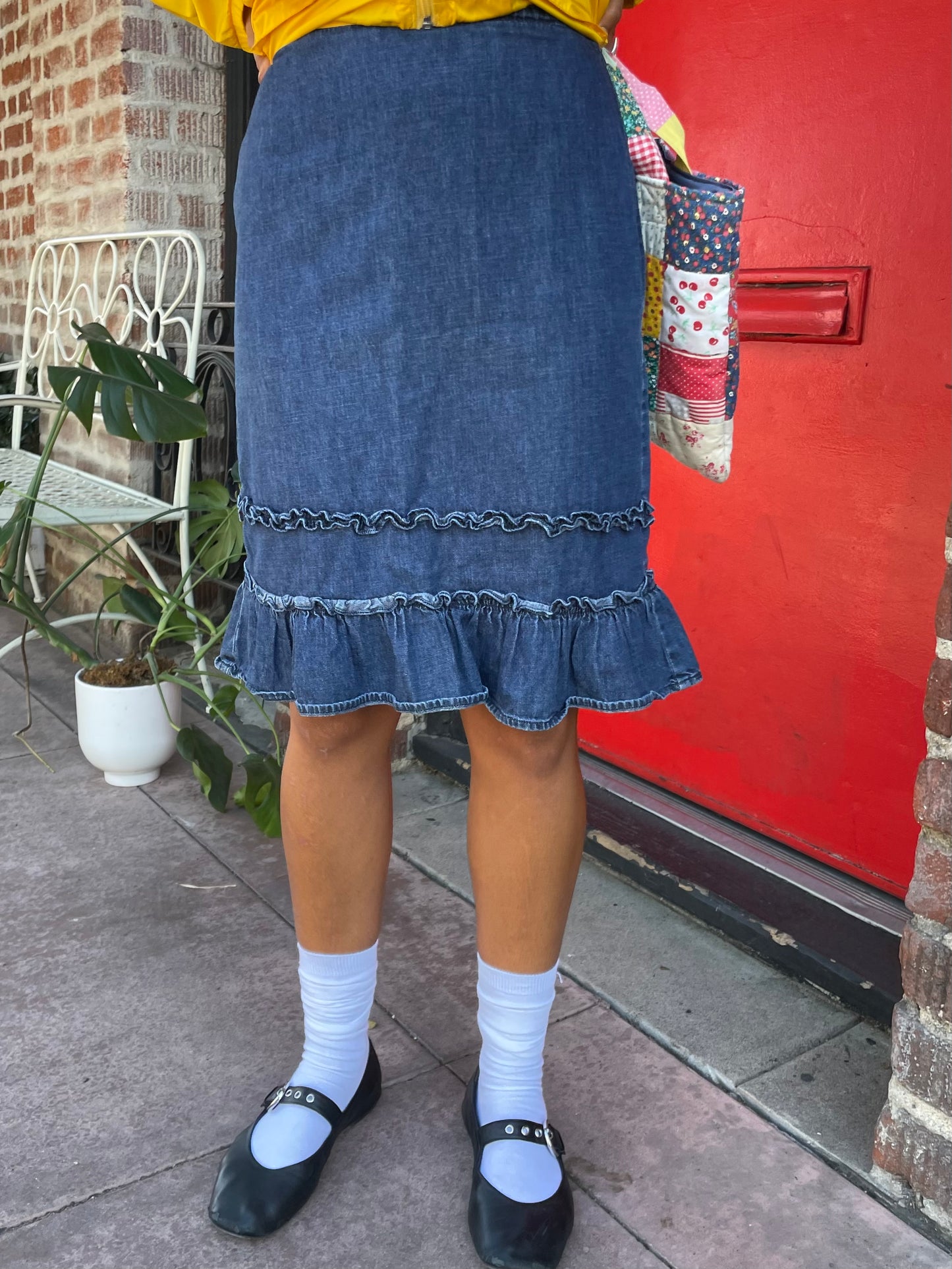 girl in denim ruffle skirt