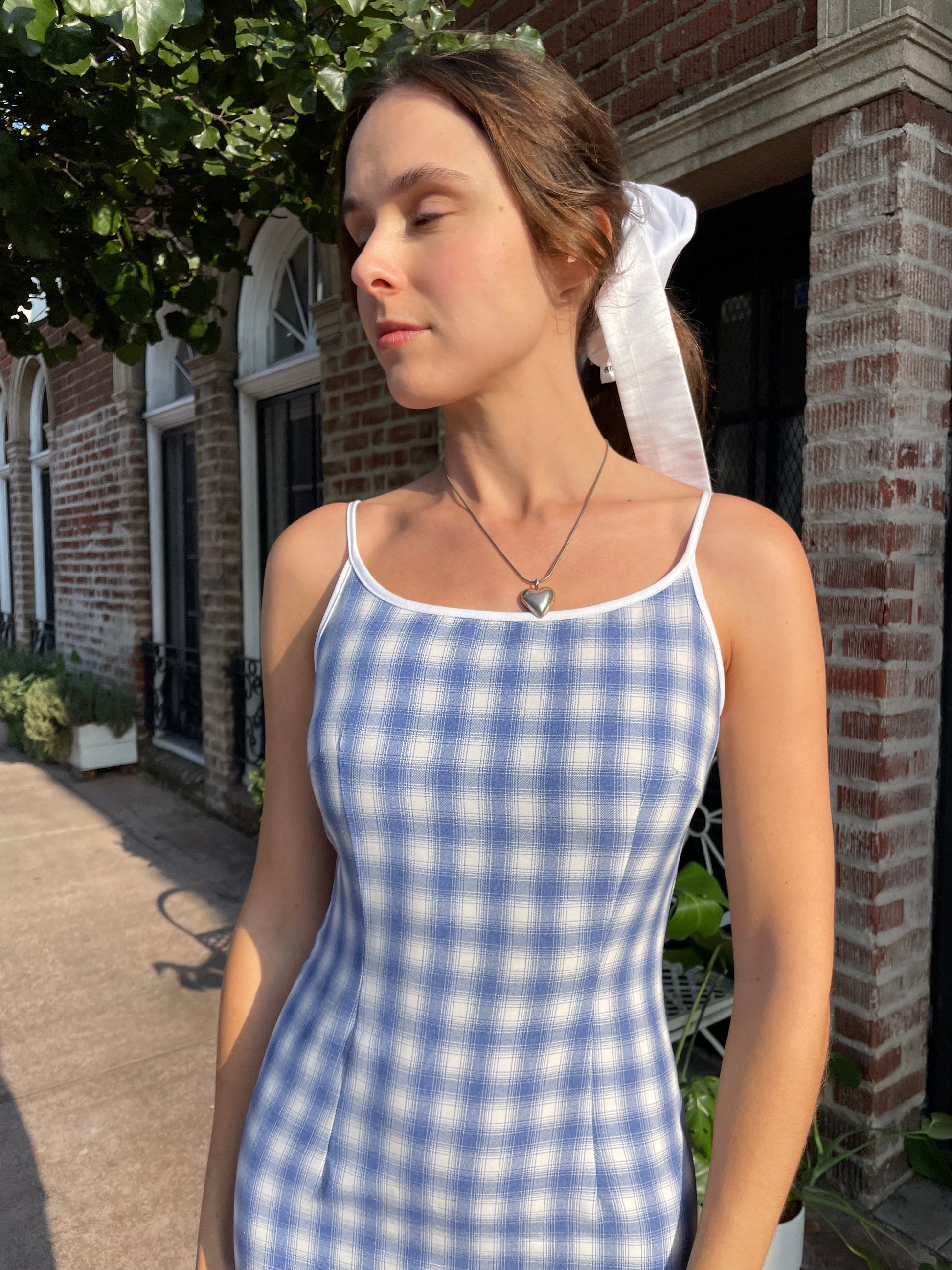 girl in blue gingham dress