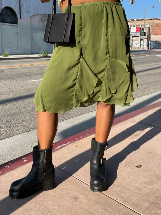 girl in green ruffle skirt