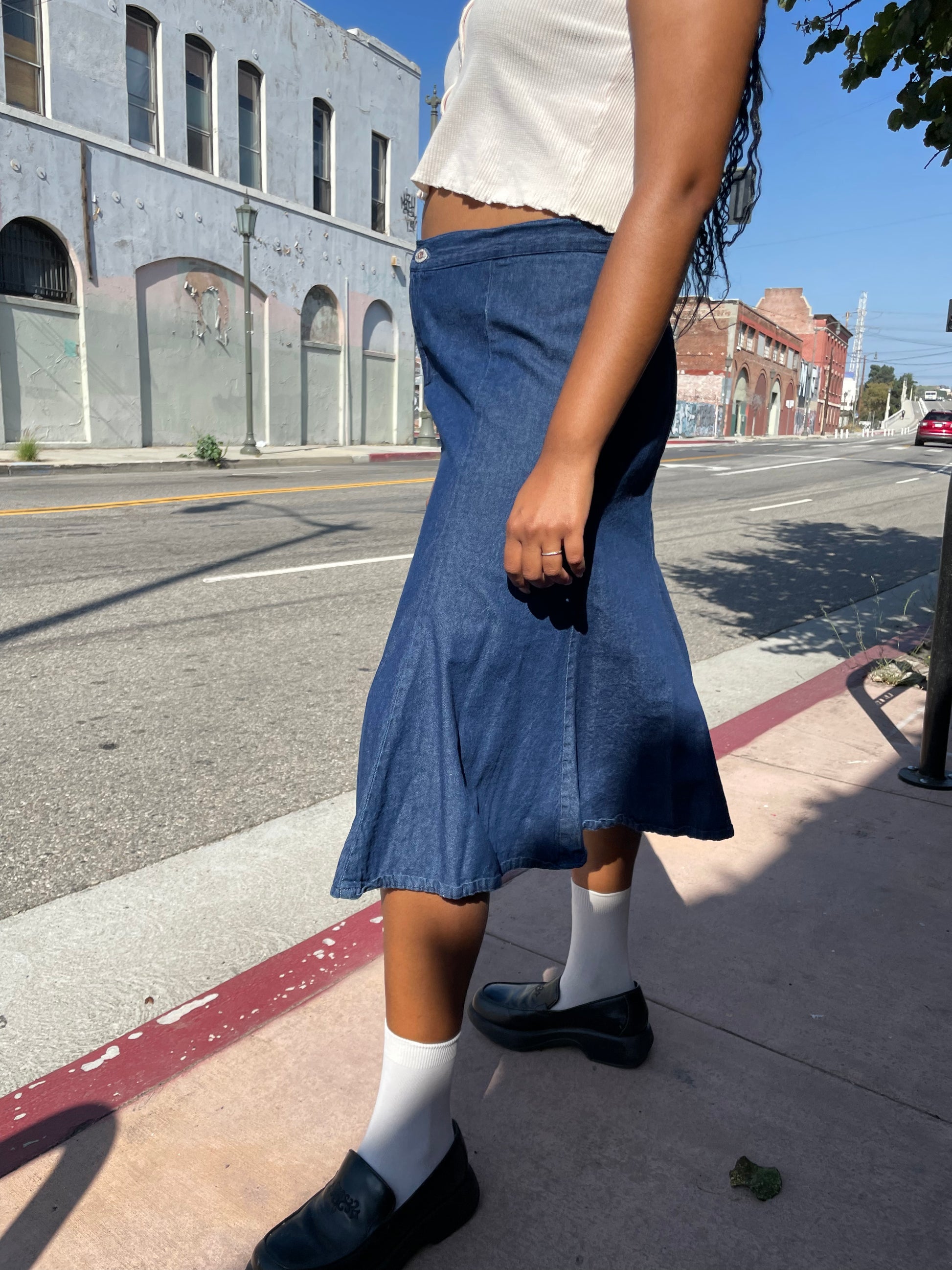 girl wearing denim skirt