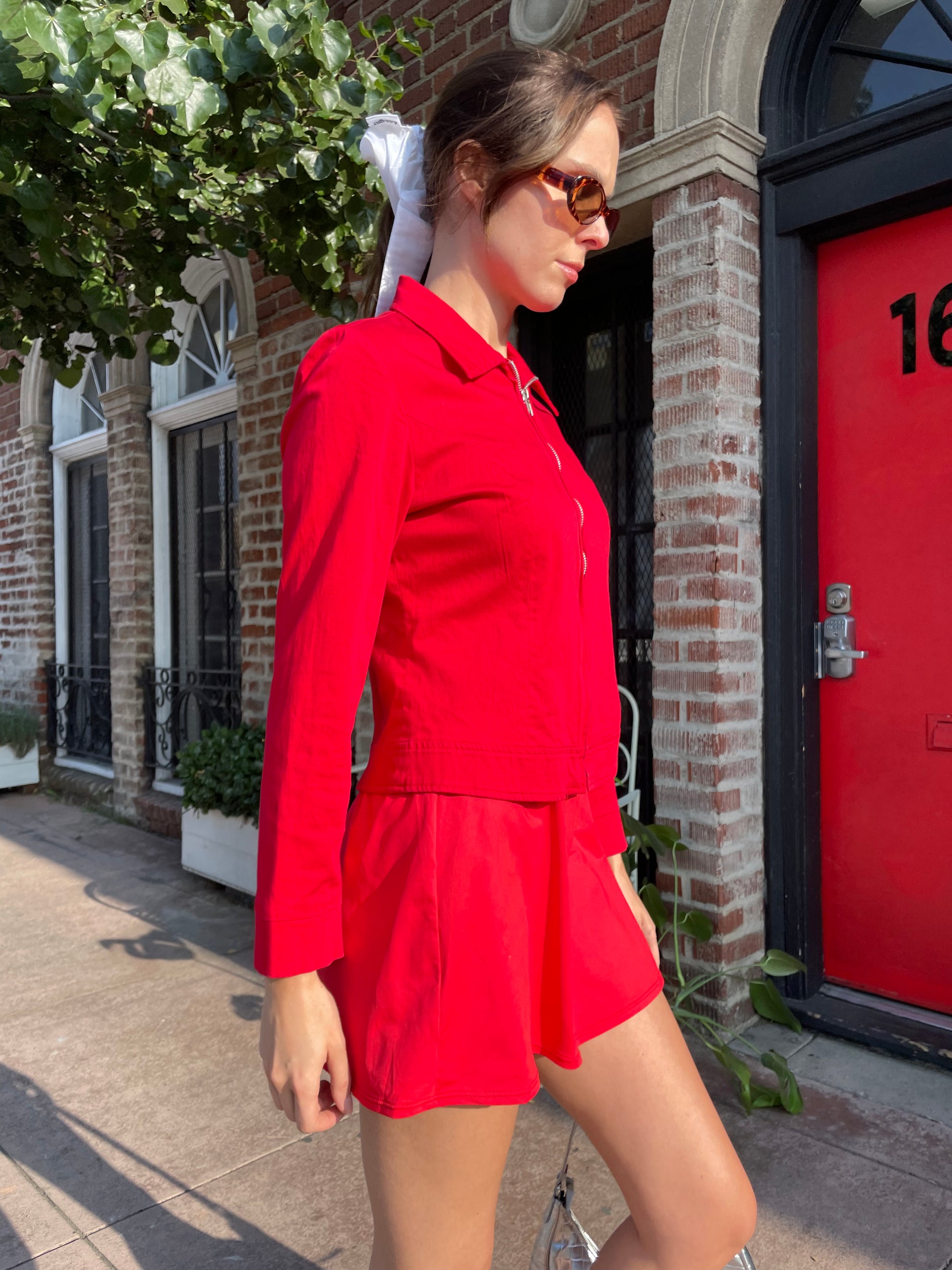 girl in red jacket and skirt