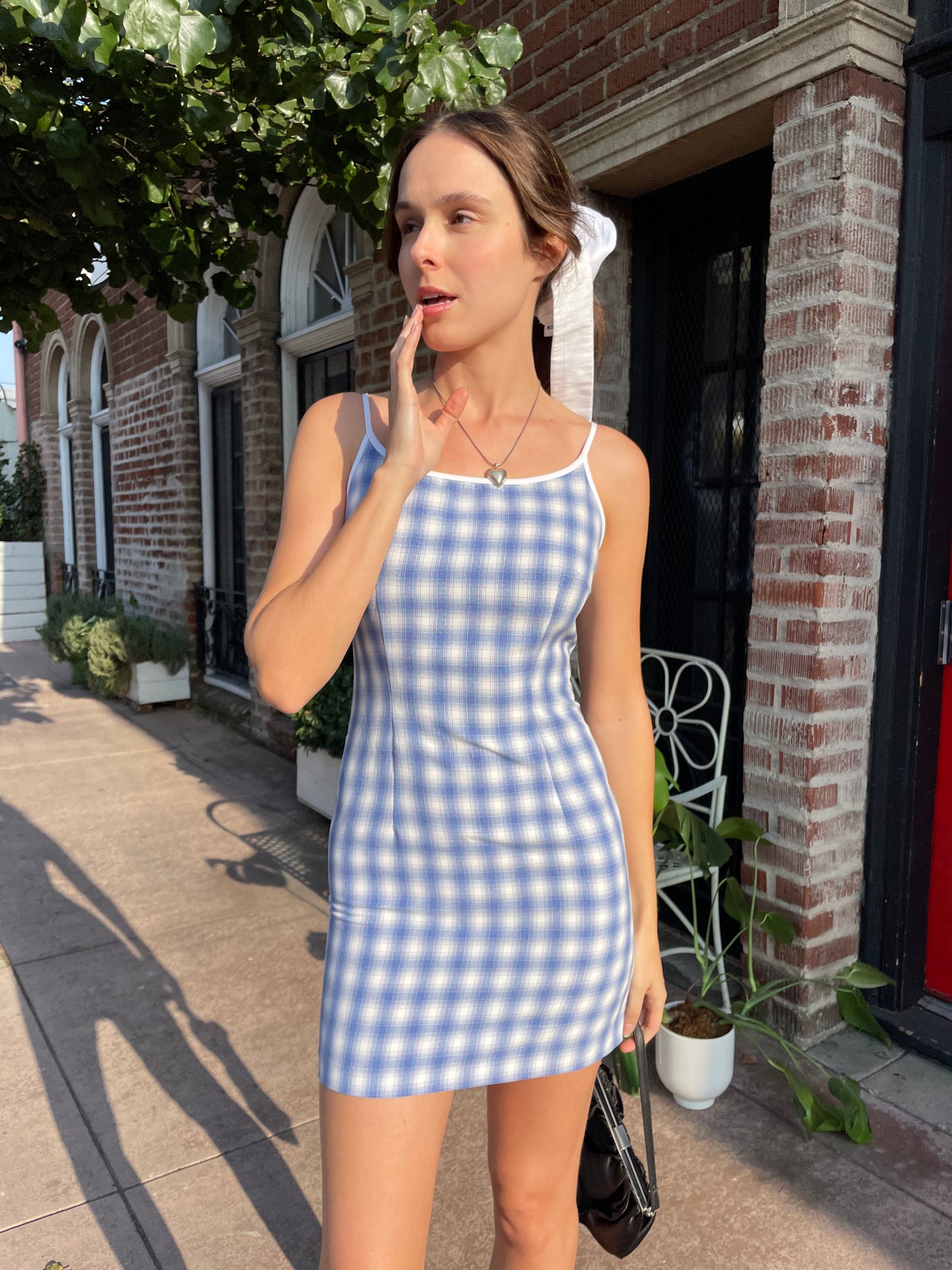 girl in blue gingham dress