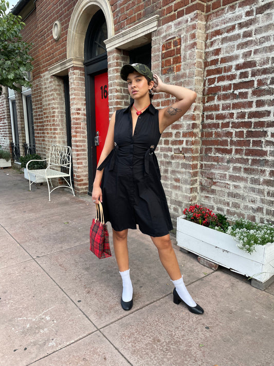 girl in black sleeveless dress