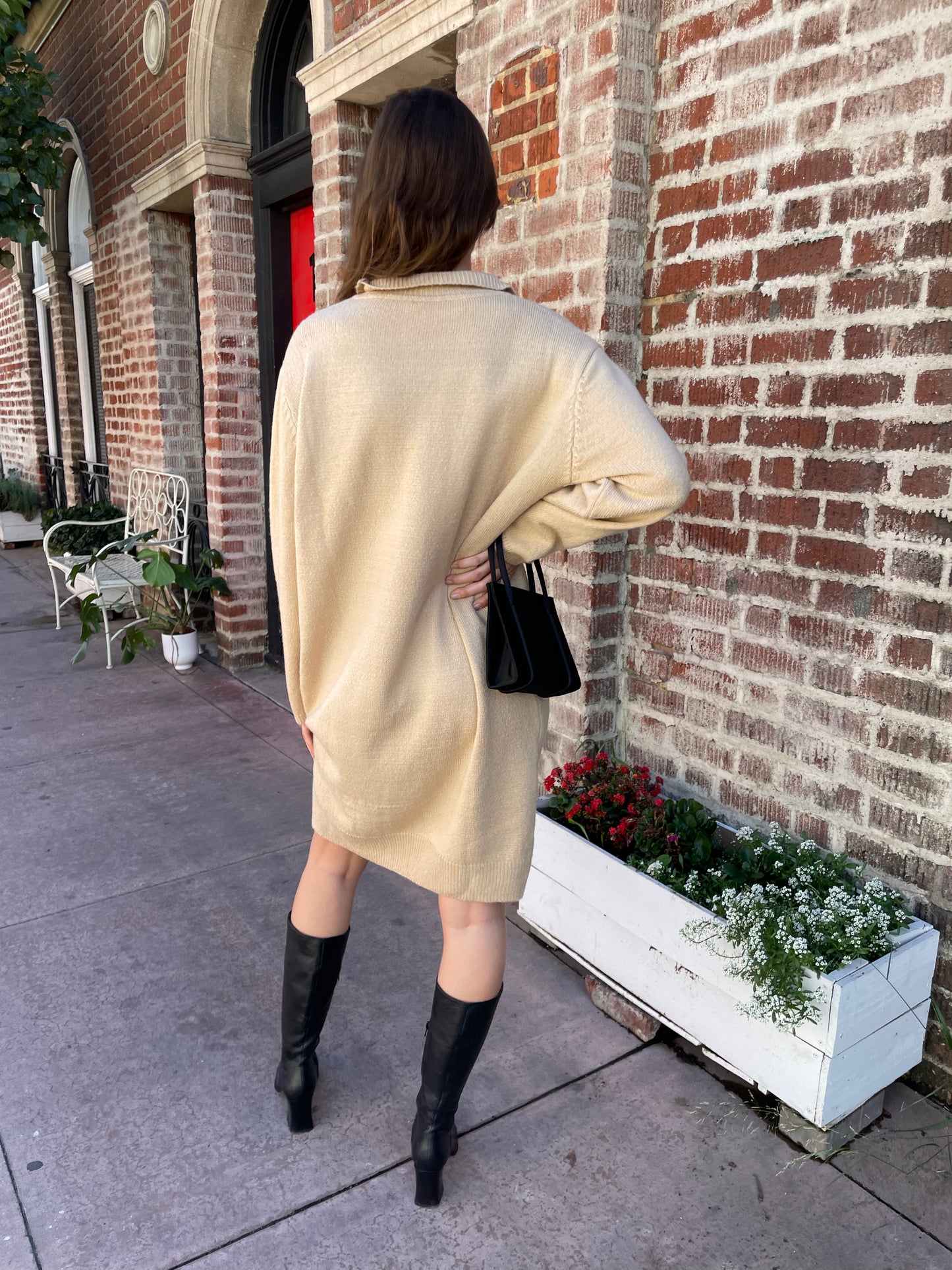 girl in tan sweater dress