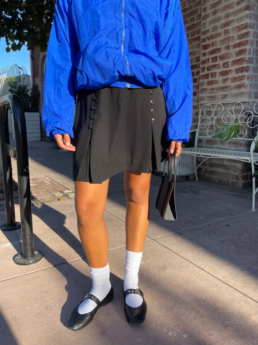 girl in black button down skirt