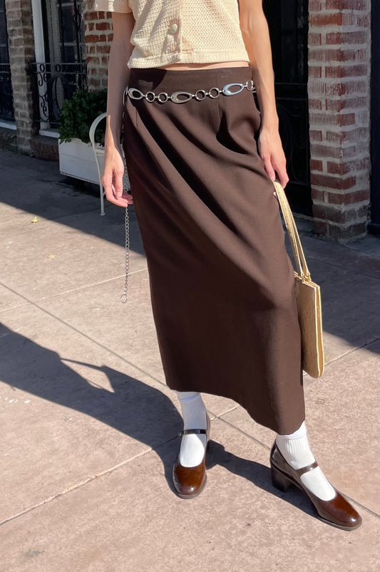 girl in yellow top and brown skirt