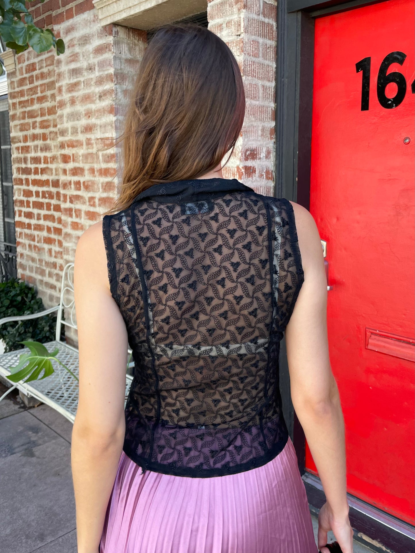 girl in black sleeveless lace top