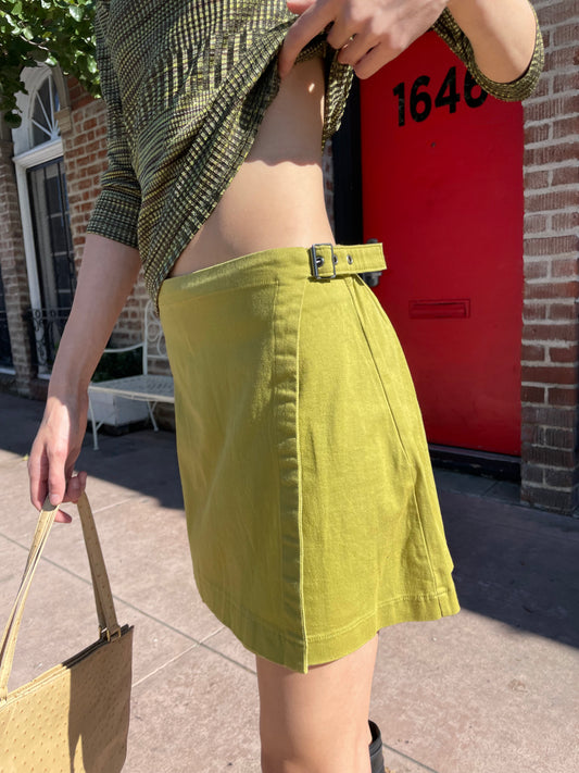 girl in green top and olive green skirt