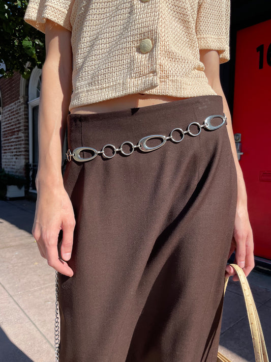 girl in yellow top and brown skirt