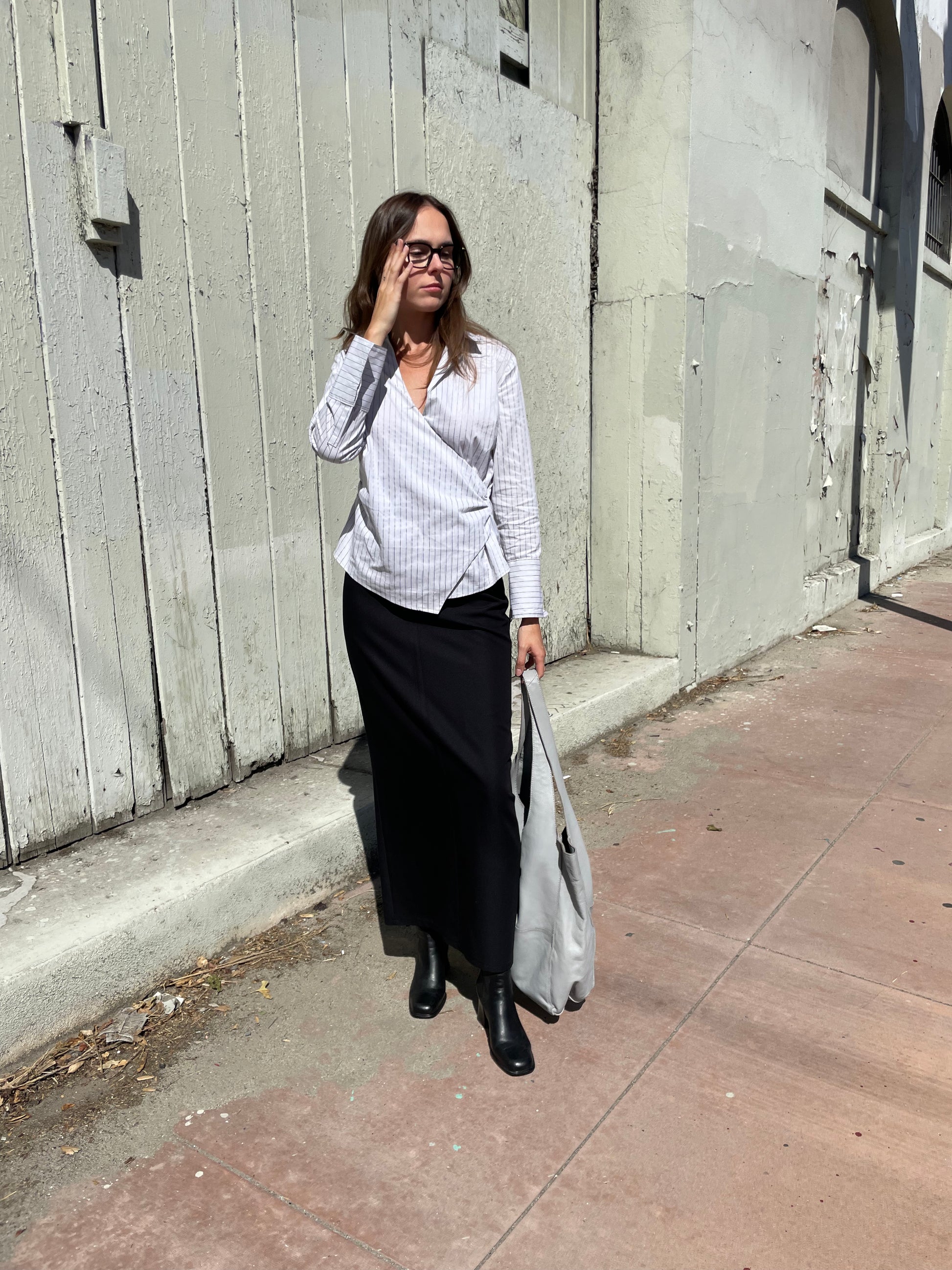 girl in long black skirt and white button up