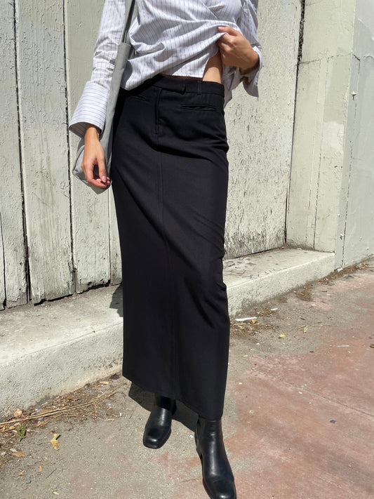 girl in long black skirt and white button up