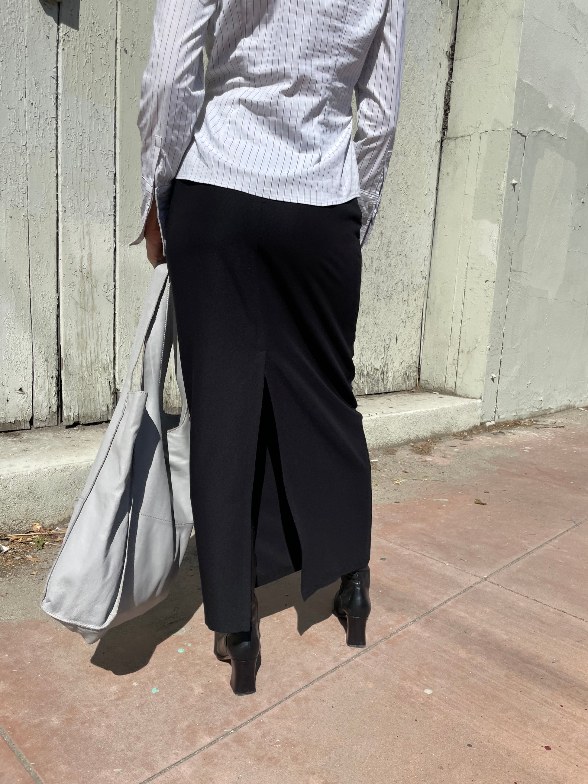 girl in long black skirt and white button up