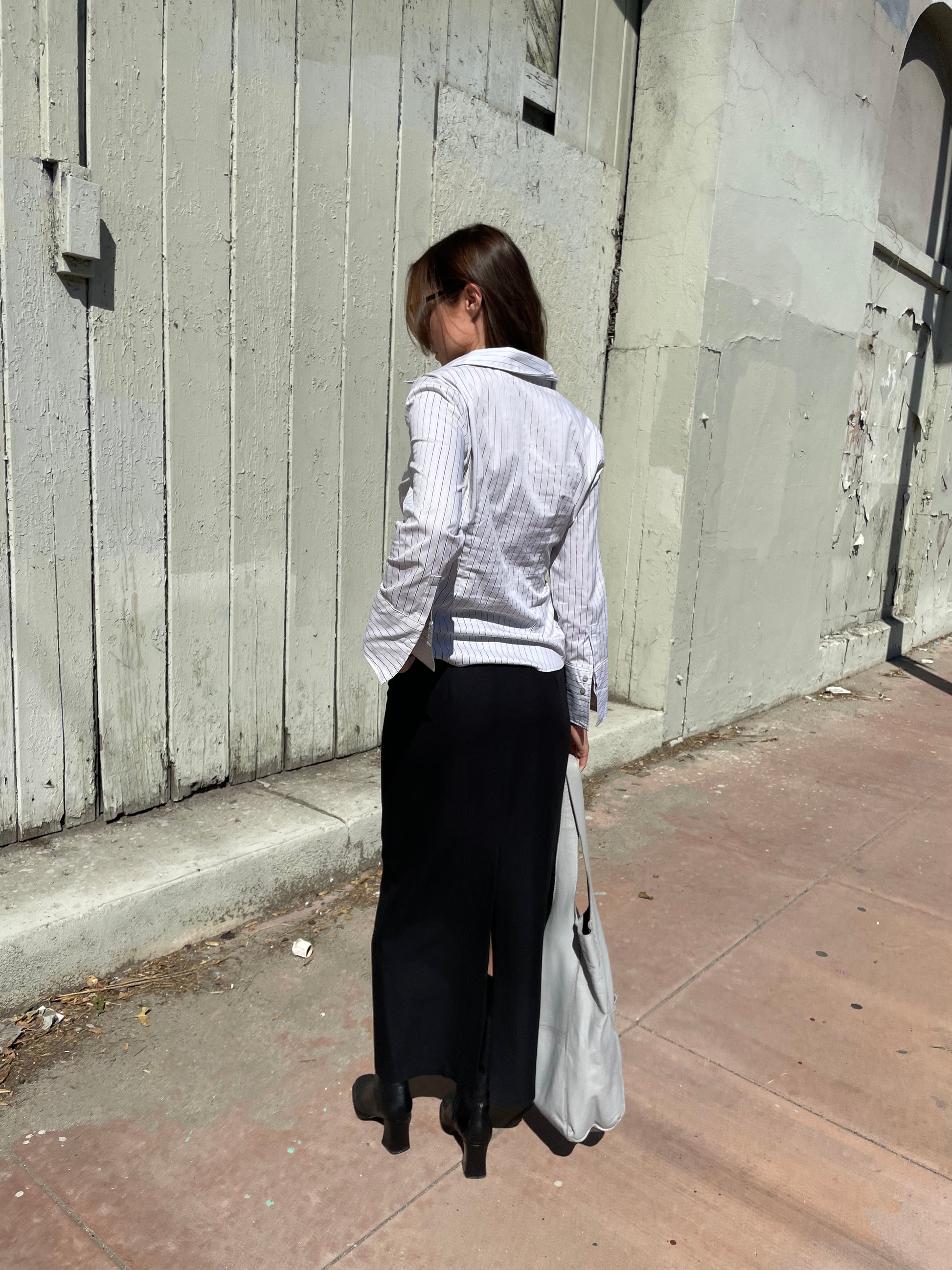 girl in long black skirt and white button up