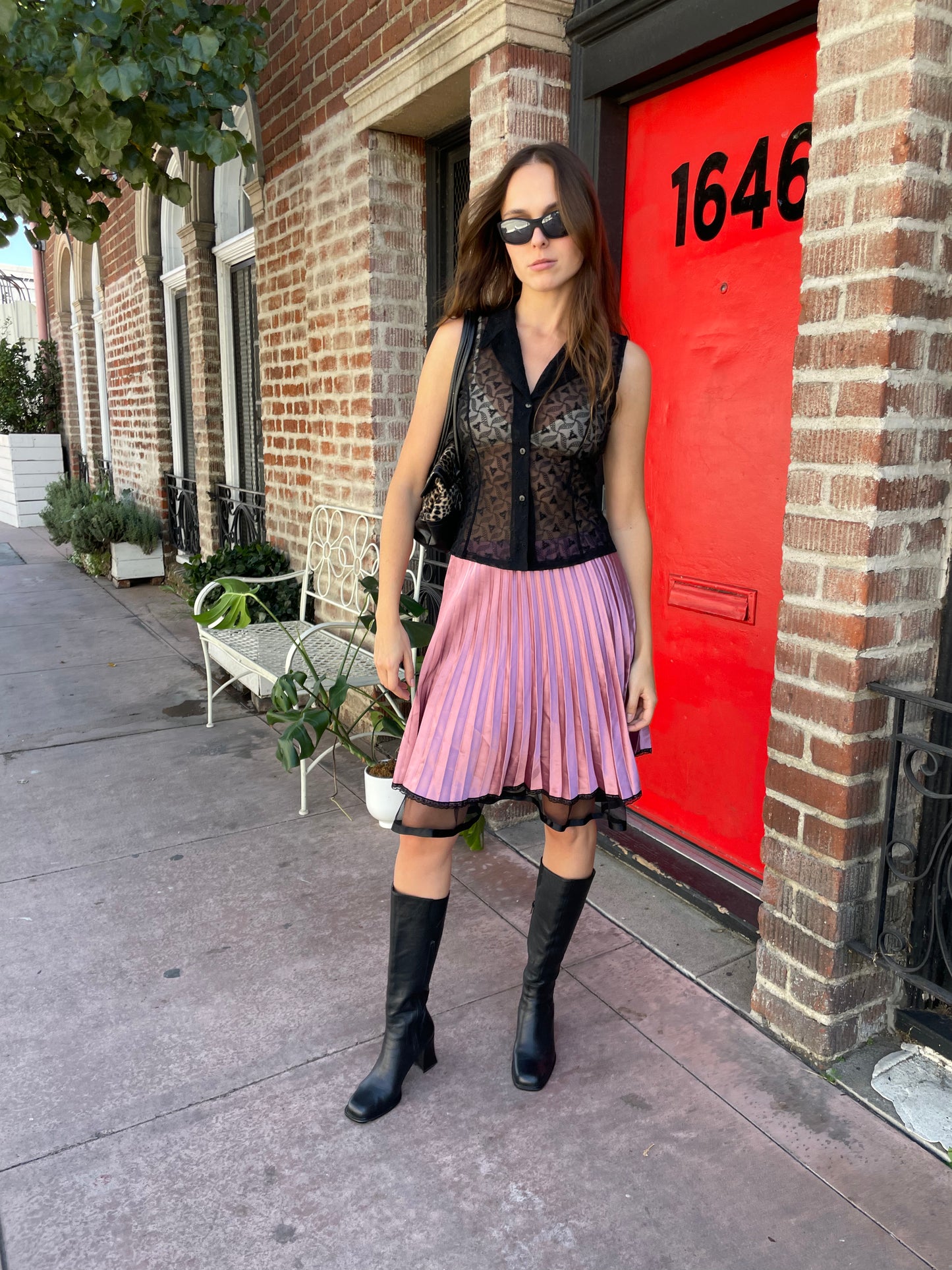 girl in black sleeveless lace top