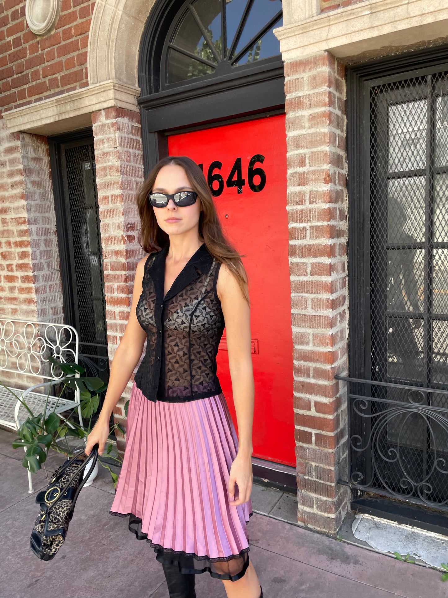 girl in black sleeveless lace top