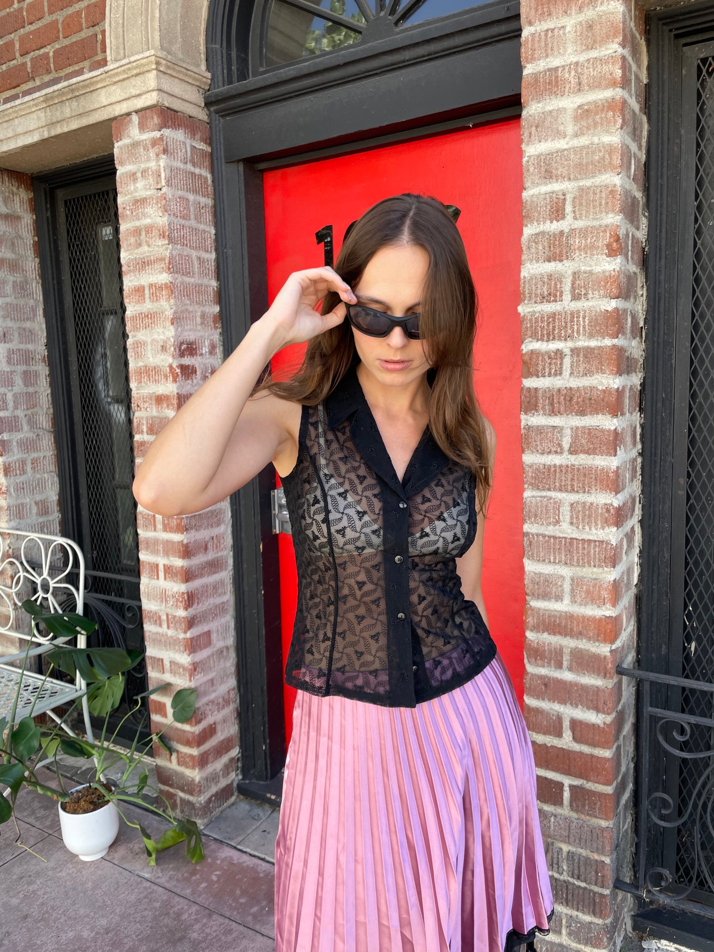 girl in black sleeveless lace top