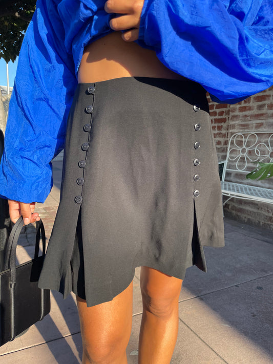 girl in black button down skirt