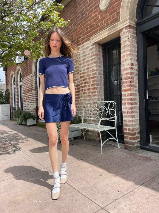 girl wearing blue top and blue skirt