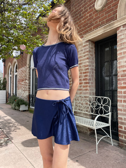 girl wearing blue top and blue skirt