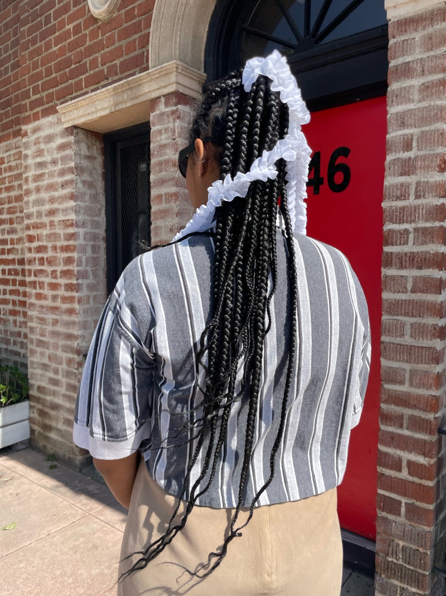 girl wearing black and white striped shirt and long tan skirt