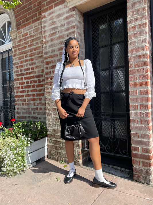 girl wearing white shirt and black skirt