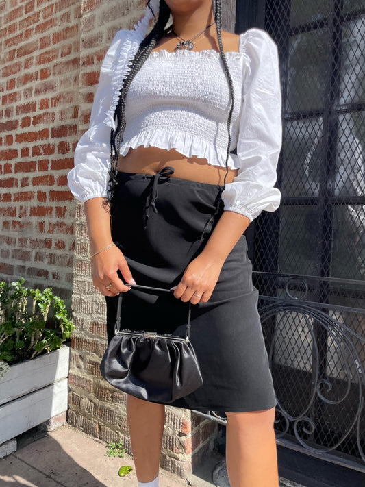 girl wearing white shirt and black skirt