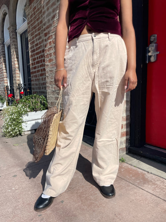 girl wearing red velvet vest and white pants