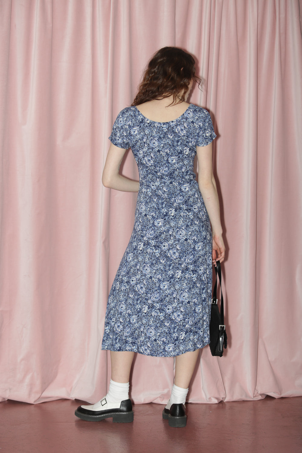 girl in blue floral dress