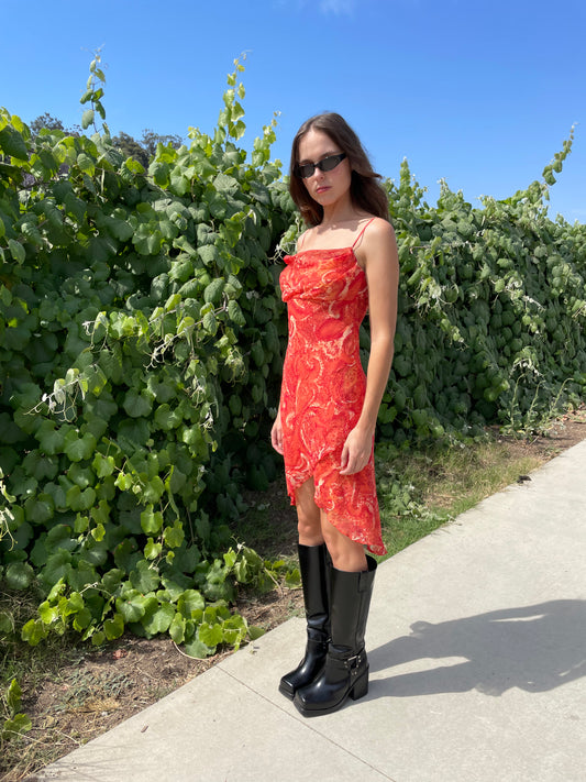 girl in orange printed dress