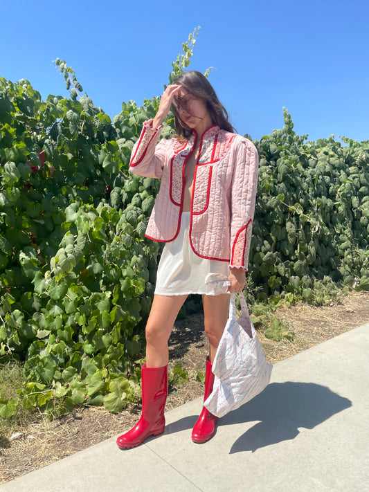 girl in pink jacket and white skirt