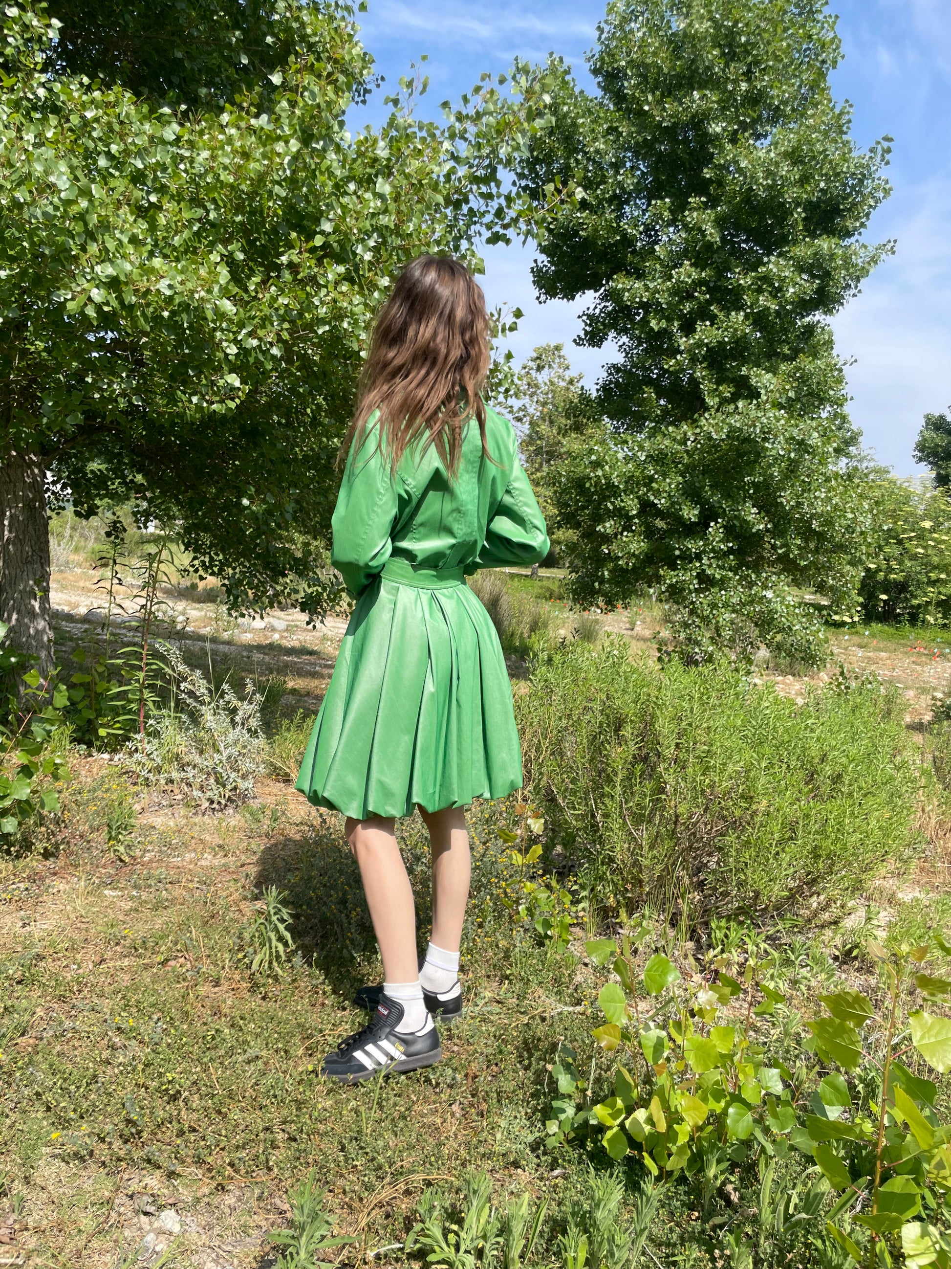 girl in green trench coat