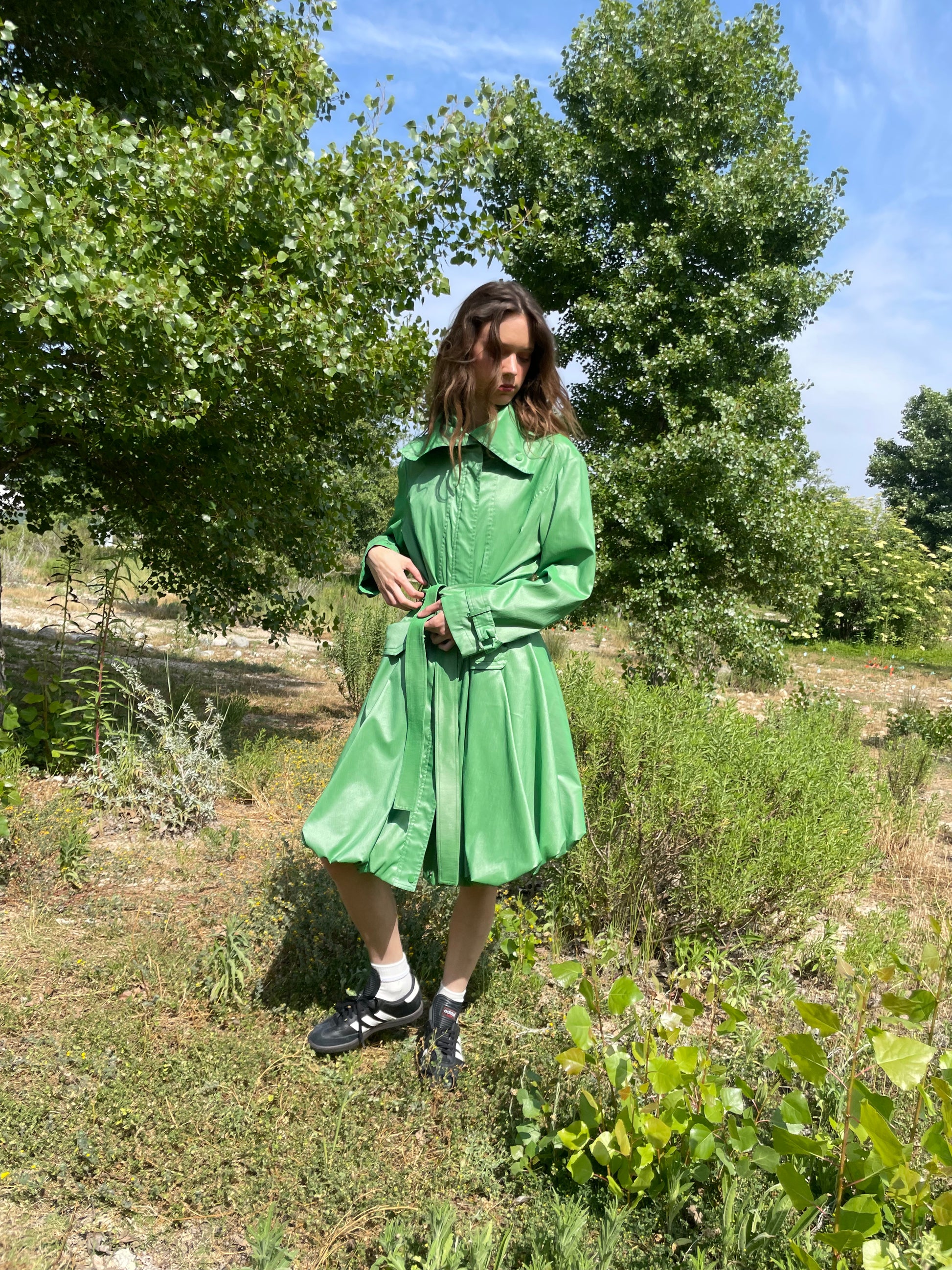 girl in green trench coat