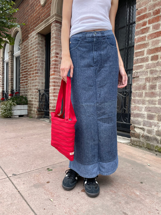 girl wearing white tank top and denim skirt