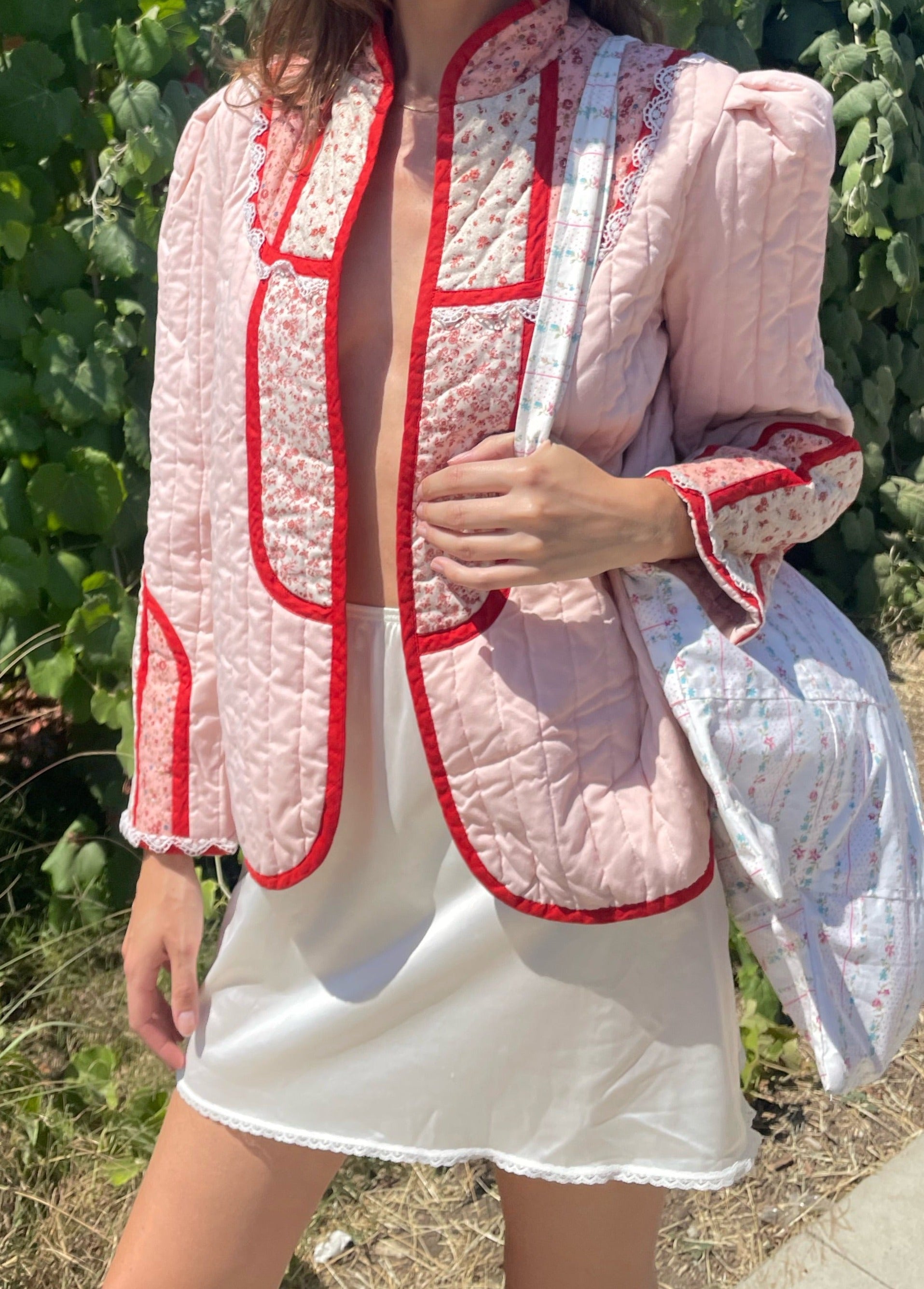 girl in pink jacket and white skirt