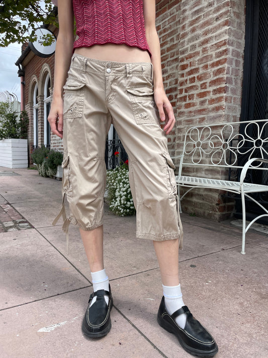 girl wearing red shirt and tan cargo pants