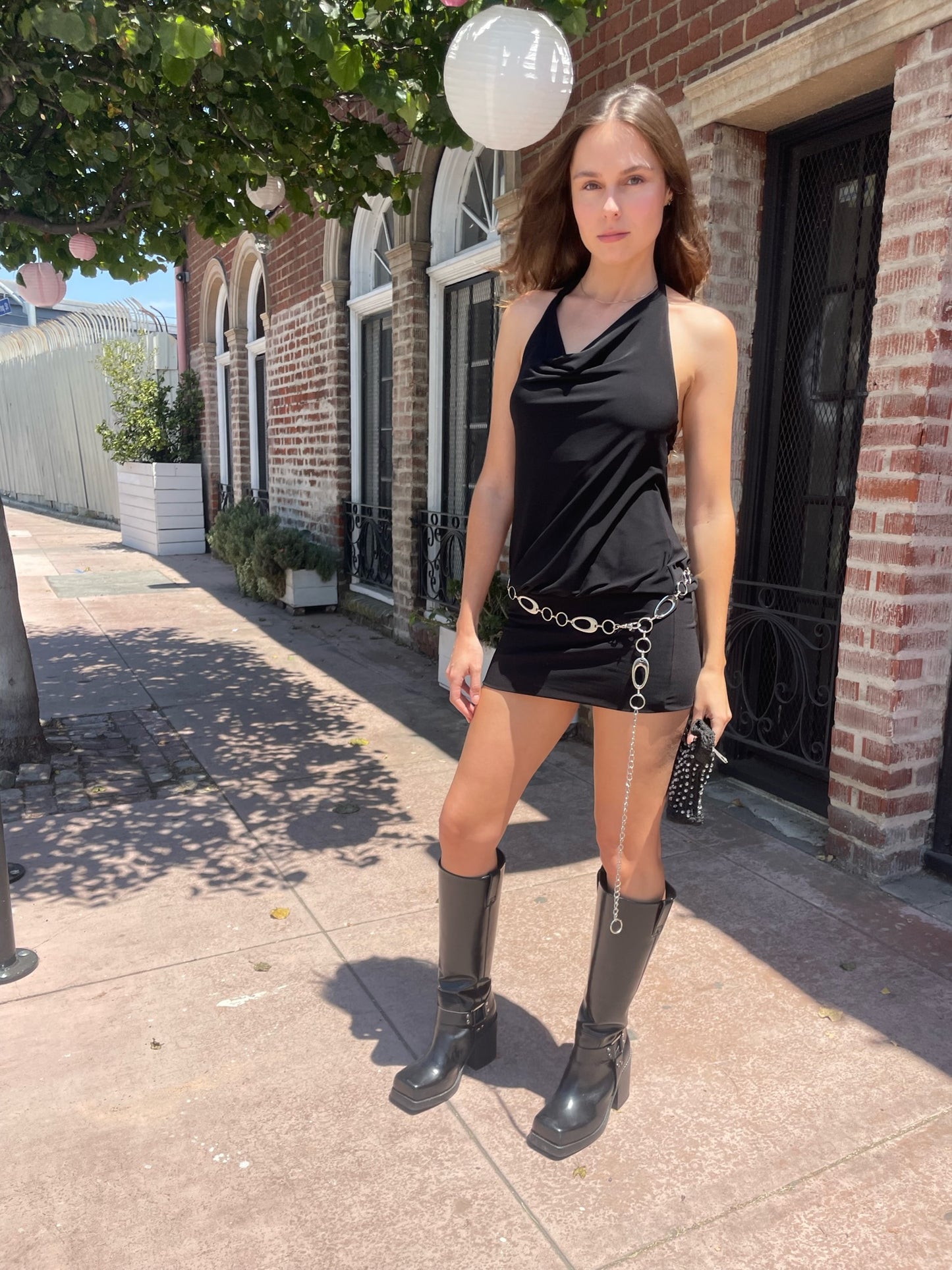 girl wearing black dress and silver belt