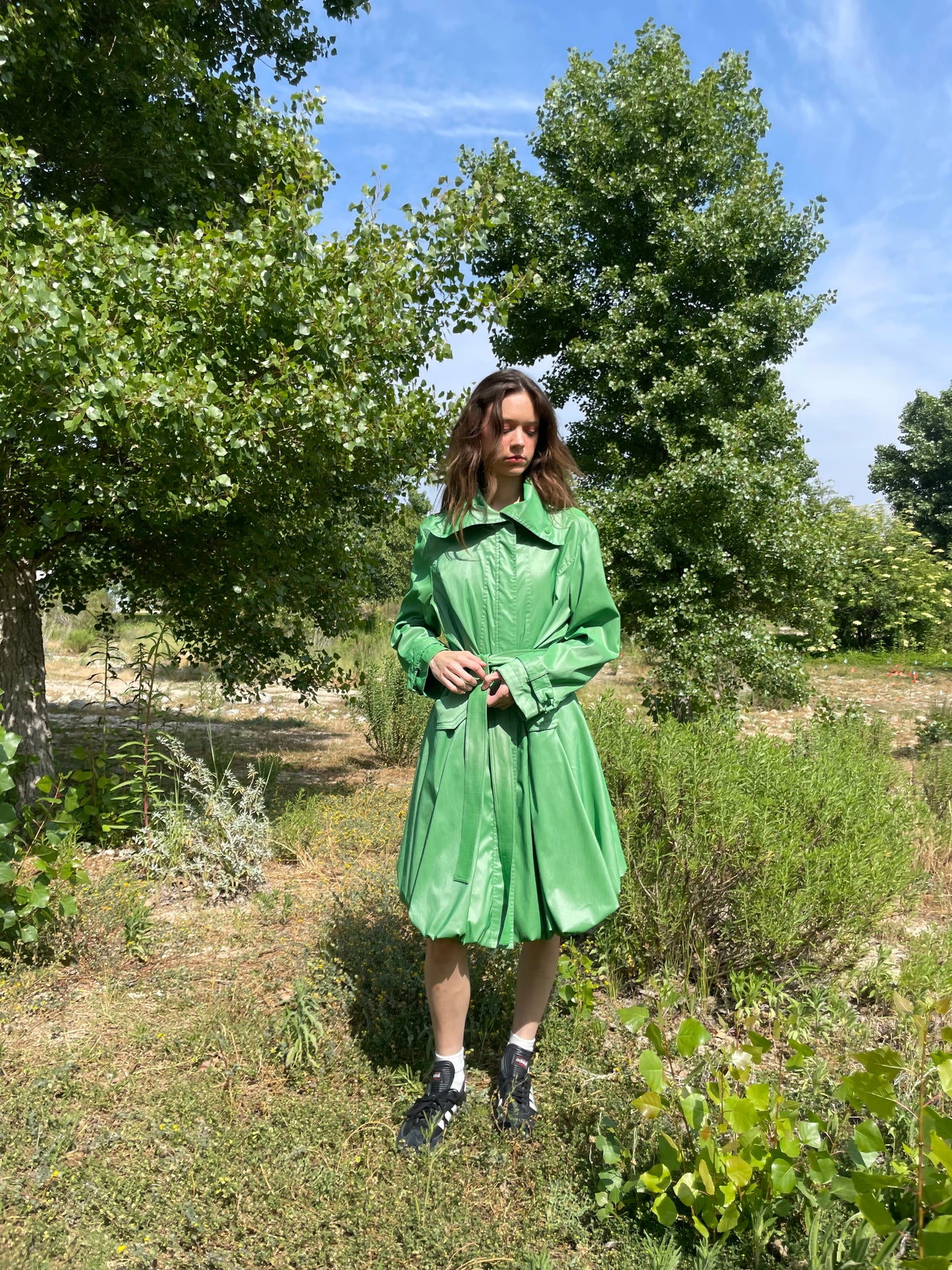 girl in green trench coat