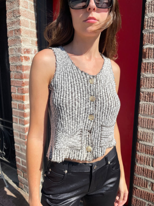 girl in brown and white top and black pants
