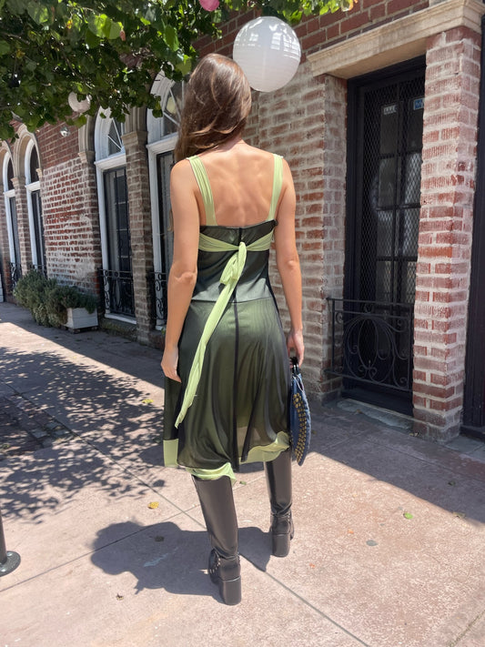 girl in black and green dress