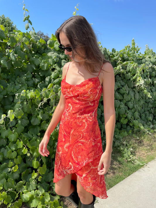 girl in orange printed dress