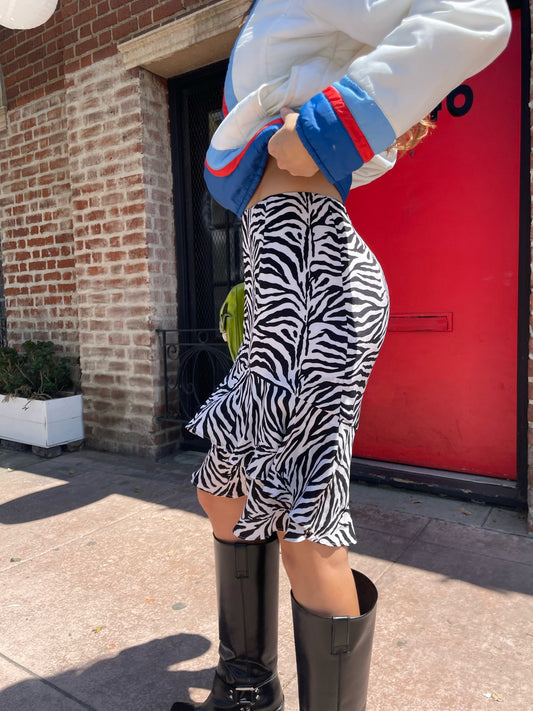 girl in zebra print skirt and sport jacket