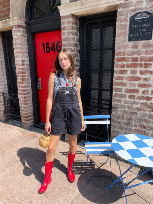 girl in black overalls
