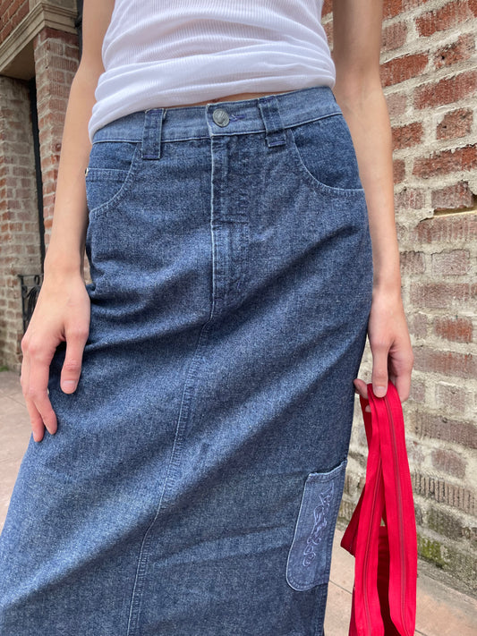 girl wearing white tank top and denim skirt