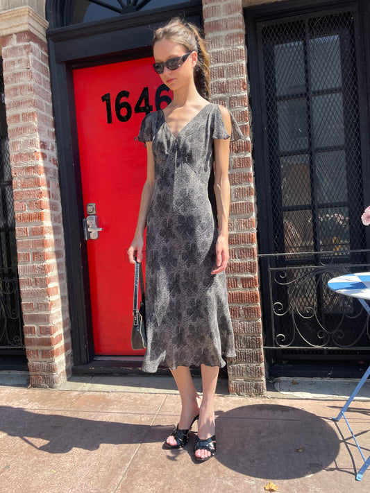 girl in black and white polka dot dress