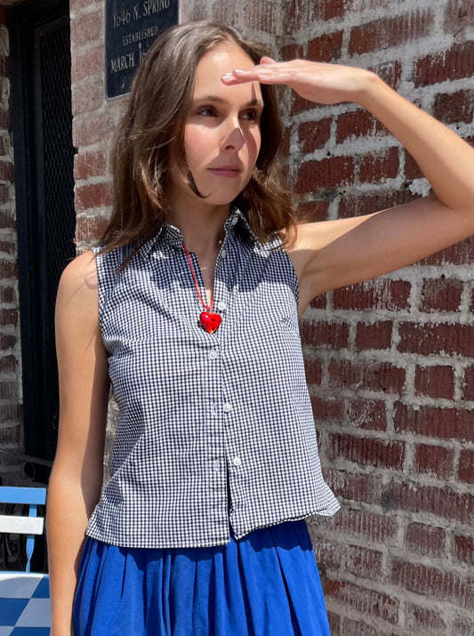 girl in white shirt and blue skirt